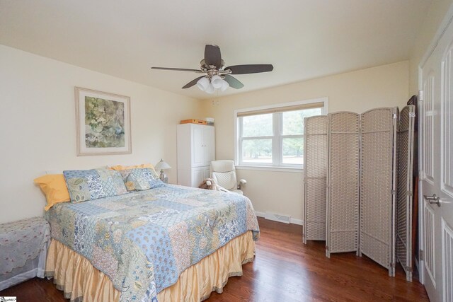 bedroom featuring dark wood-type flooring and ceiling fan