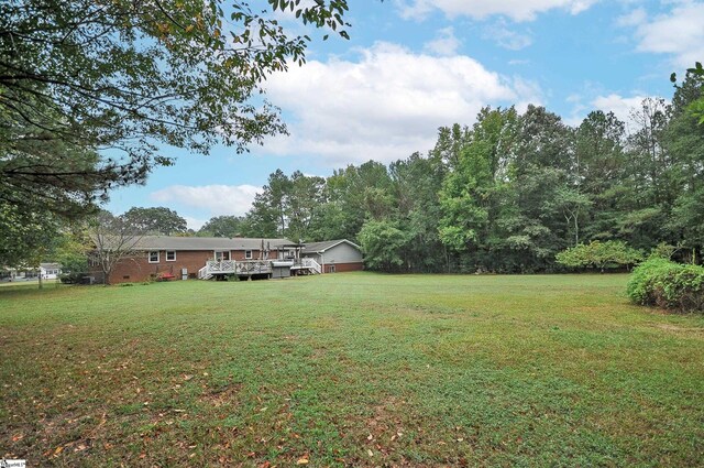 view of yard featuring a deck