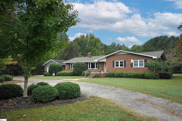 single story home featuring a front yard