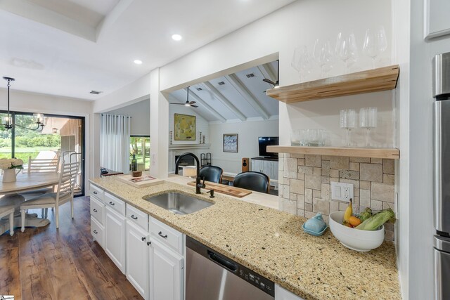 kitchen with light stone counters, wall chimney range hood, decorative backsplash, and black electric stovetop