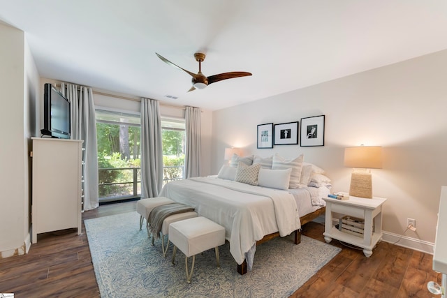 bedroom with ceiling fan, dark hardwood / wood-style floors, and access to outside