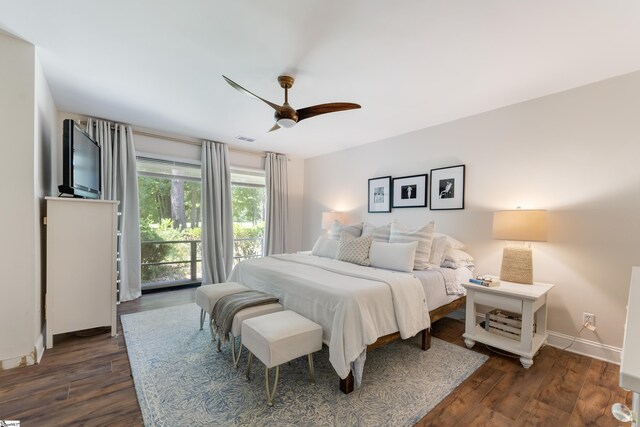 bedroom featuring ceiling fan, dark hardwood / wood-style floors, and access to outside