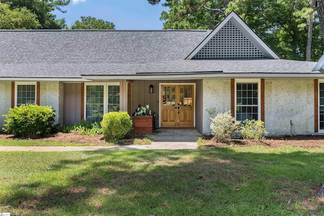 ranch-style house featuring a front yard