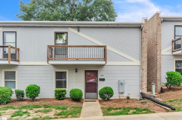 multi unit property featuring a balcony