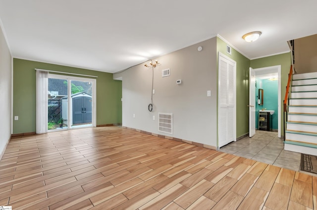 empty room featuring ornamental molding