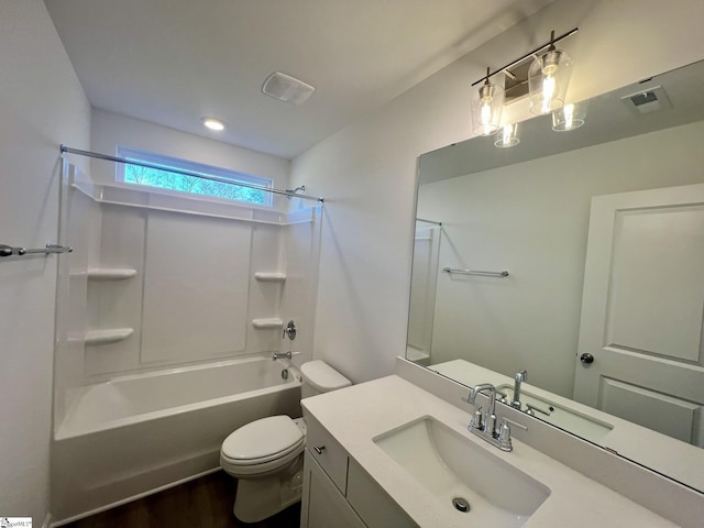 full bathroom featuring wood-type flooring, toilet, vanity, and shower / washtub combination