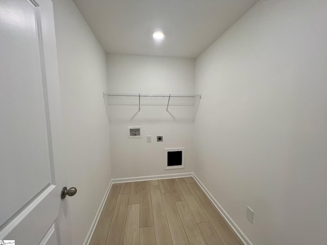 laundry area featuring washer hookup, hookup for an electric dryer, and hardwood / wood-style flooring