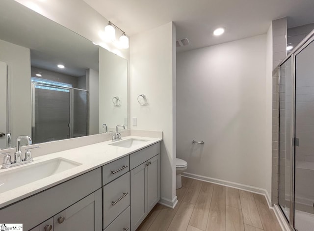 218 Brochaill Ct, Piedmont, SC 29673 - bathroom with vanity, hardwood / wood-style floors, toilet, and walk in shower