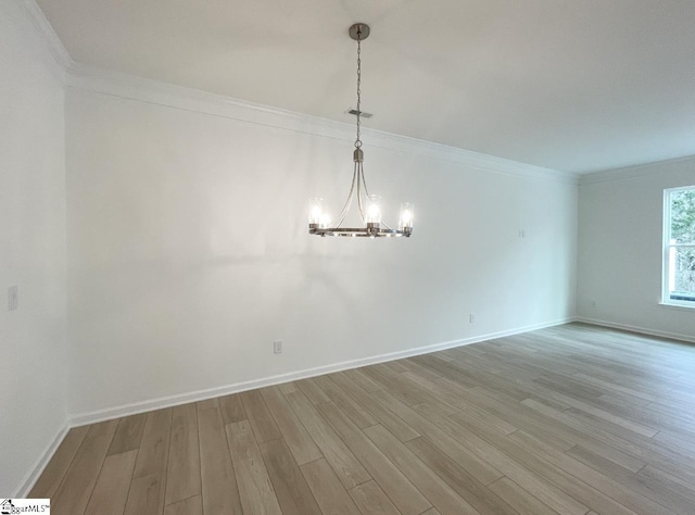 218 Brochaill Ct, Piedmont, SC 29673 - empty room featuring an inviting chandelier, ornamental molding, and hardwood / wood-style floors