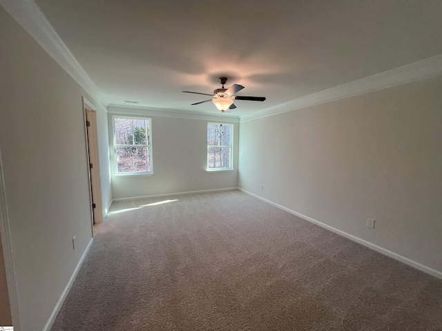 carpeted empty room with ceiling fan and ornamental molding