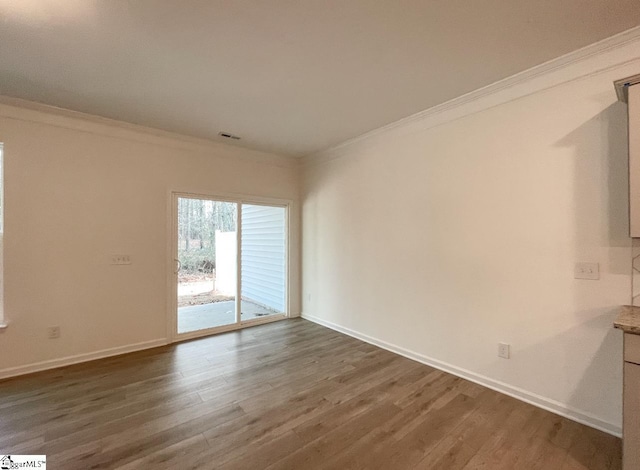 214 Brochaill Ct, Piedmont, SC 29673 - spare room with crown molding and dark hardwood / wood-style flooring