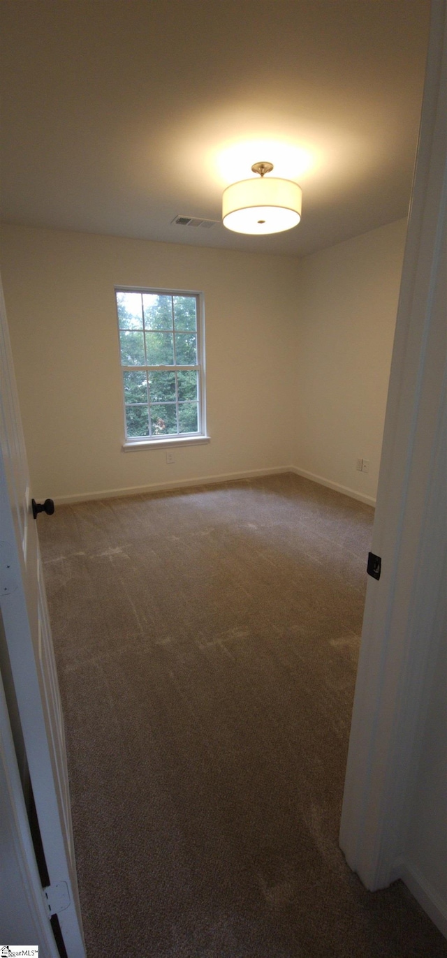316 Windy Meadow Way, Simpsonville, SC 29680 - carpeted empty room with visible vents and baseboards
