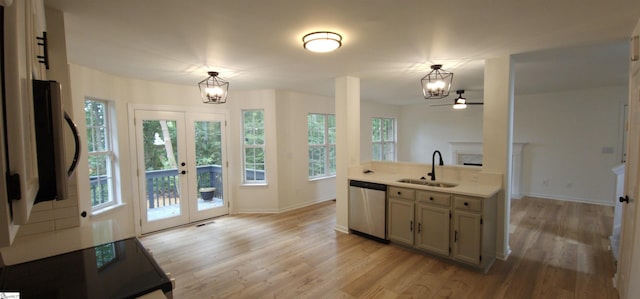 316 Windy Meadow Way, Simpsonville, SC 29680 - kitchen featuring light wood-type flooring, a chandelier, dishwasher, light countertops, and a sink