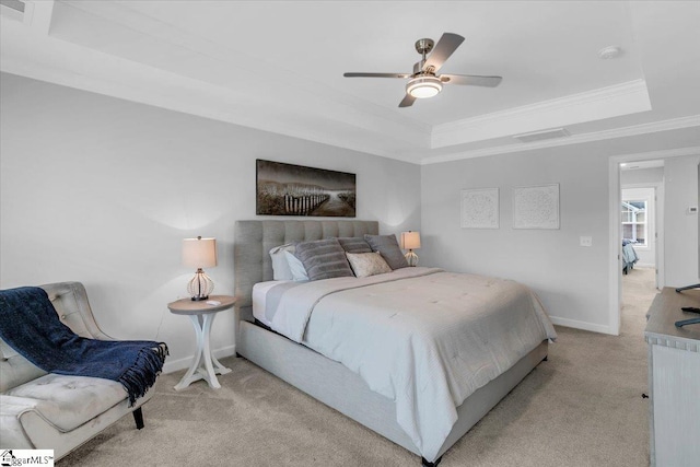 bedroom with light colored carpet, ceiling fan, a raised ceiling, and crown molding