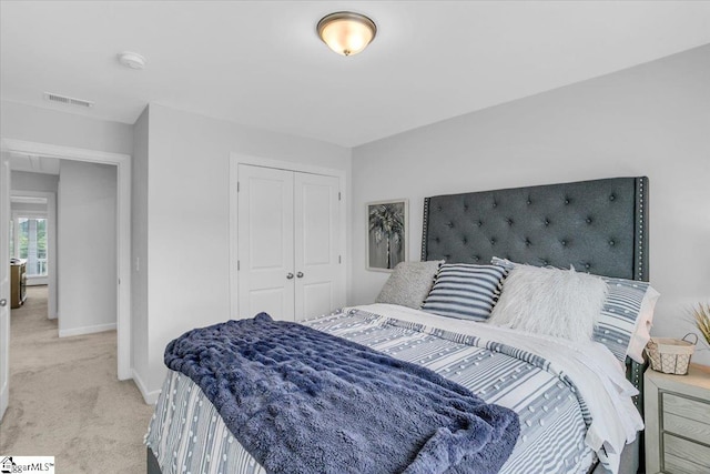 carpeted bedroom with a closet