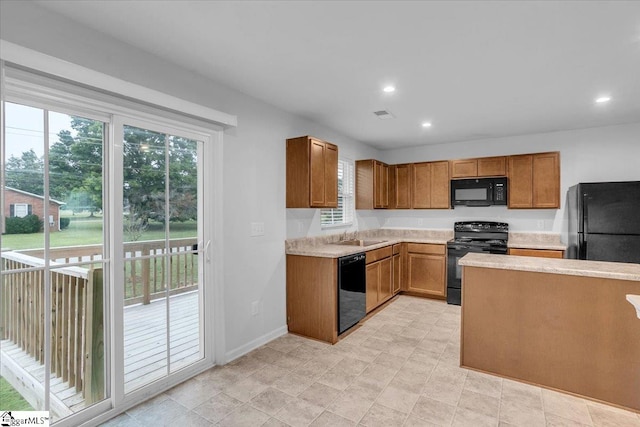 kitchen featuring black appliances and sink