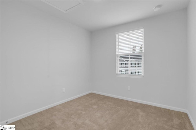 unfurnished room with light carpet