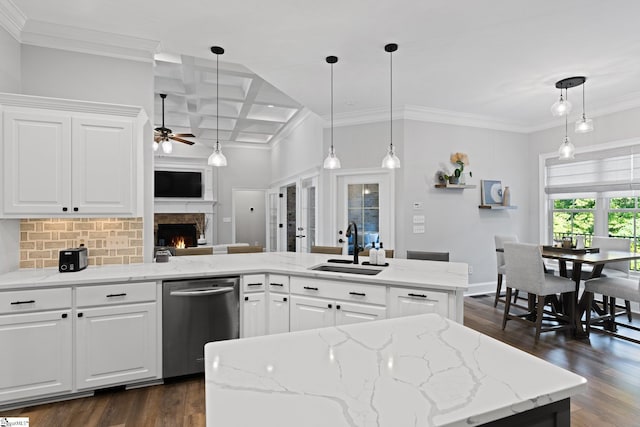 kitchen featuring ceiling fan, sink, white cabinetry, coffered ceiling, and dishwasher