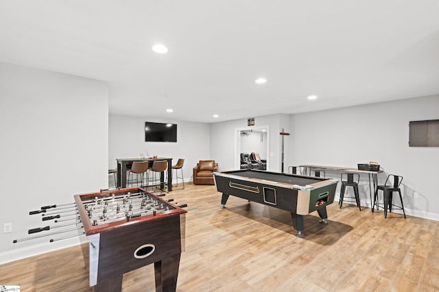 recreation room with billiards and light hardwood / wood-style flooring