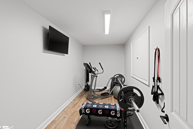 exercise area featuring hardwood / wood-style flooring