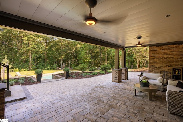 view of patio with outdoor lounge area and ceiling fan