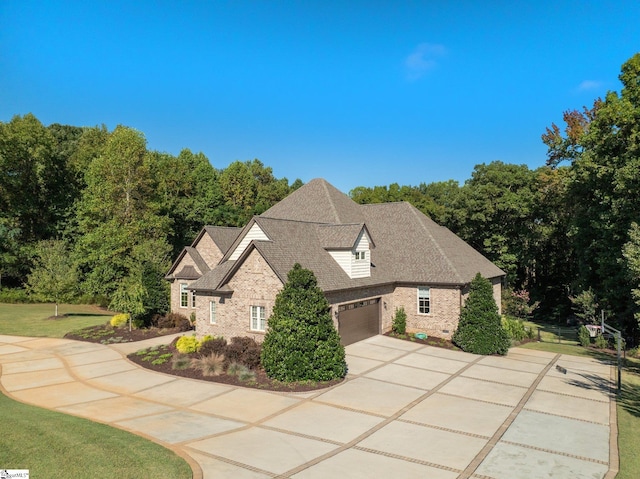 view of property exterior featuring a lawn and a garage