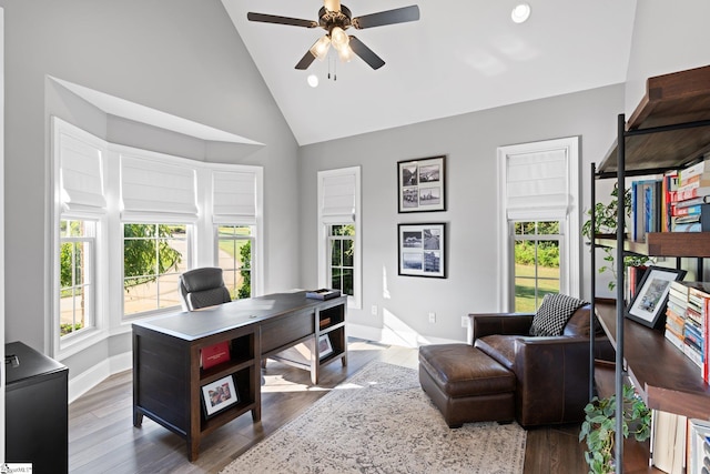 office space with high vaulted ceiling, wood-type flooring, and ceiling fan