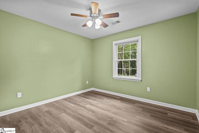 spare room featuring ceiling fan and light wood-type flooring