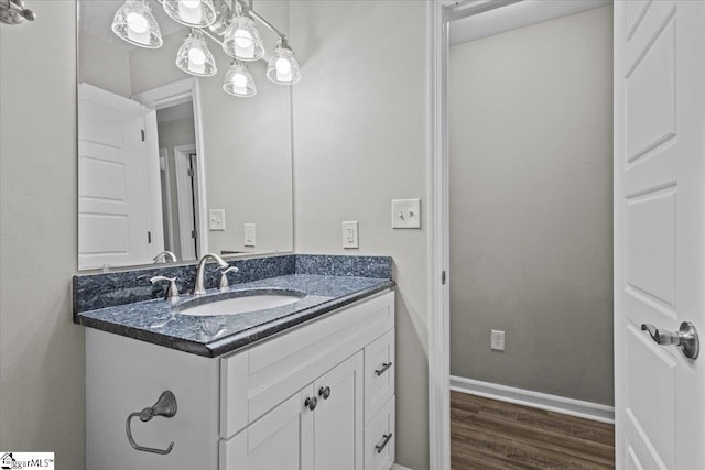 bathroom featuring wood-type flooring and vanity