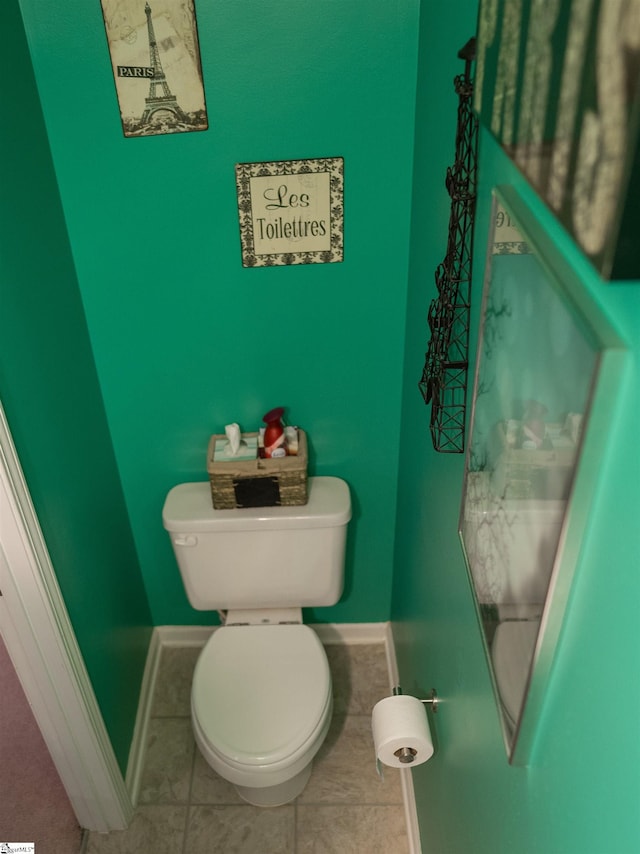 bathroom featuring toilet and tile patterned floors