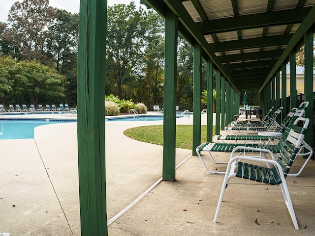 view of patio with a community pool