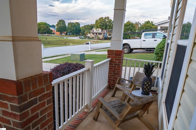 balcony featuring a porch