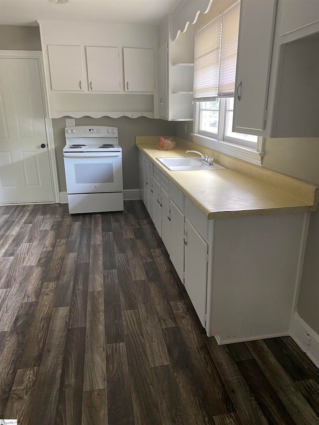 kitchen with white cabinetry, sink, and electric range