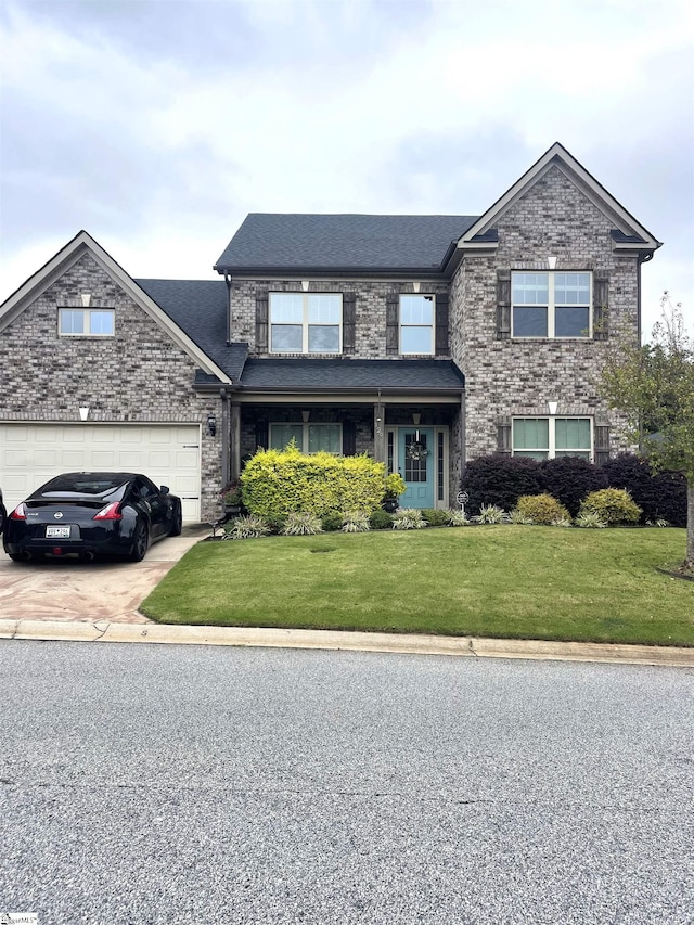 front of property featuring a garage and a front lawn