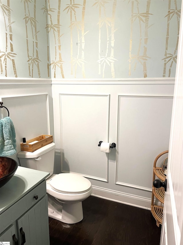 bathroom with vanity, hardwood / wood-style floors, and toilet