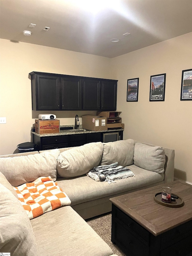 living room featuring light colored carpet and sink