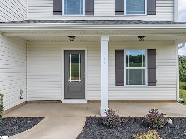 doorway to property with covered porch