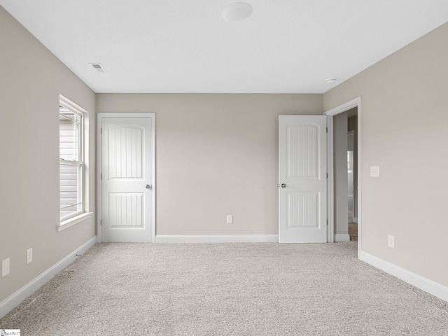 unfurnished bedroom with carpet flooring