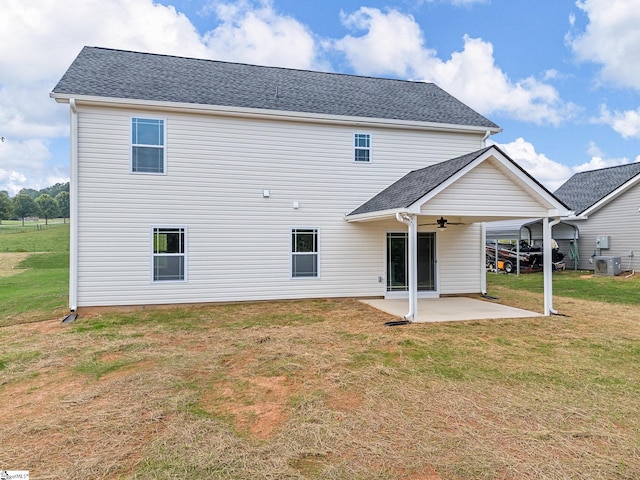 back of house with a lawn, a patio, ceiling fan, and central AC unit