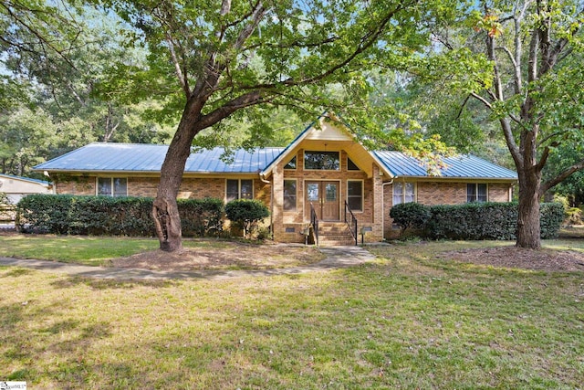 ranch-style house with a front lawn