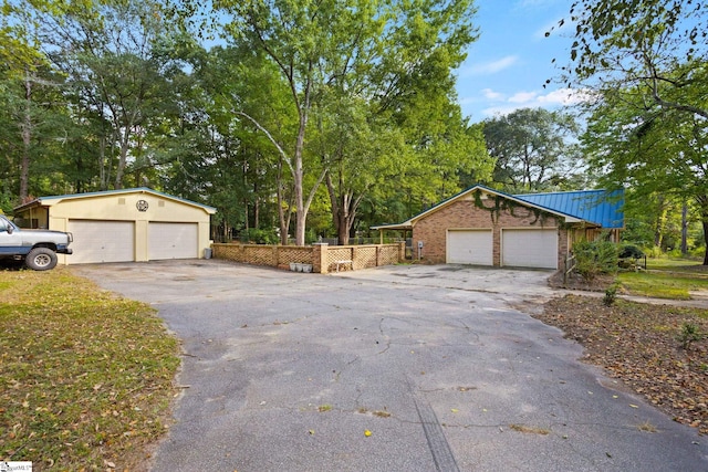 exterior space with an outdoor structure and a garage