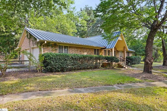 ranch-style house with a garage and a front yard