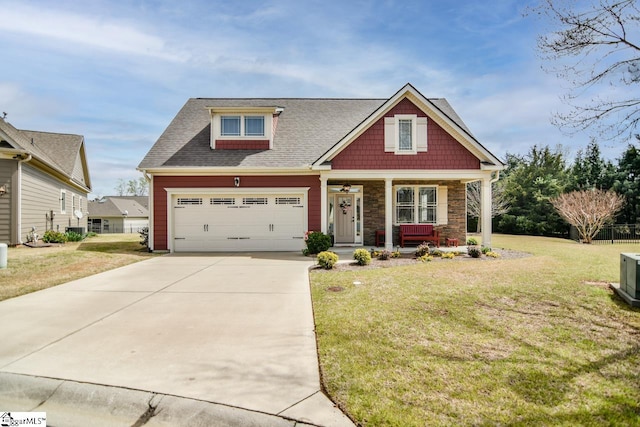 craftsman-style home featuring a garage, a front lawn, and covered porch