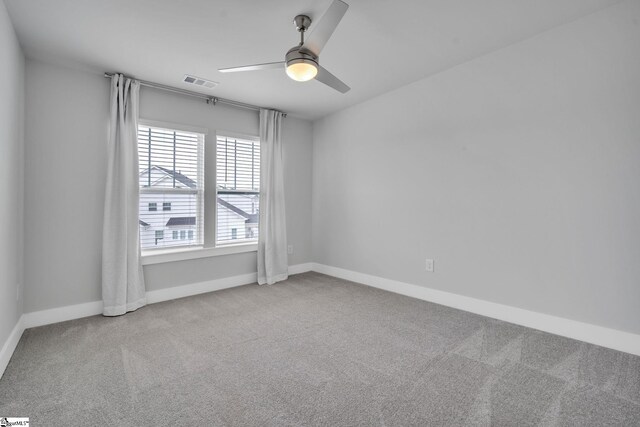 empty room featuring carpet and ceiling fan