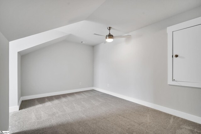 bonus room featuring lofted ceiling, ceiling fan, and carpet flooring