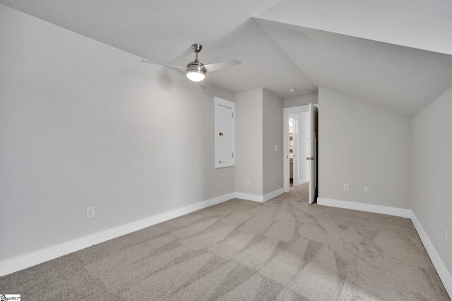 bonus room with lofted ceiling, light colored carpet, and ceiling fan