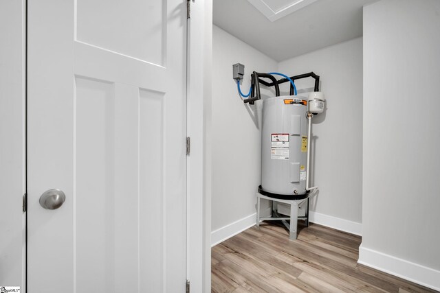 utility room featuring electric water heater