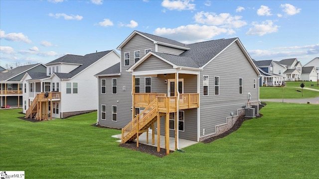 back of property with a wooden deck, central AC, and a lawn