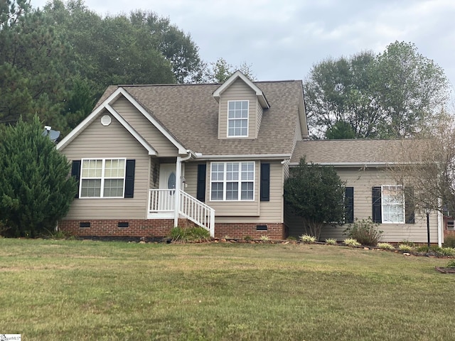 cape cod home featuring a front lawn