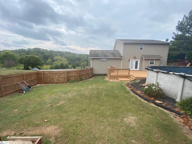 view of yard featuring a swimming pool side deck